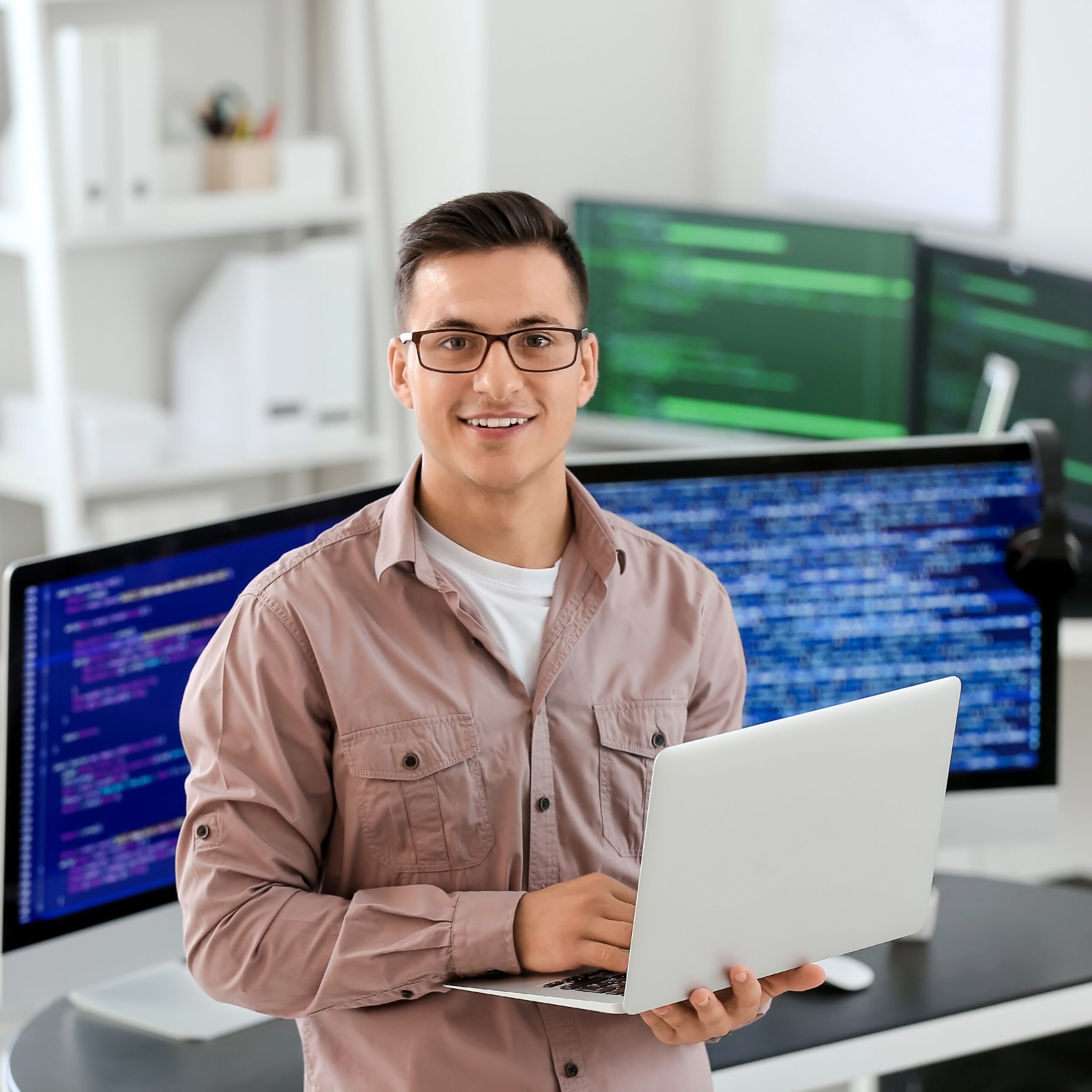 Portrait of male programmer in office